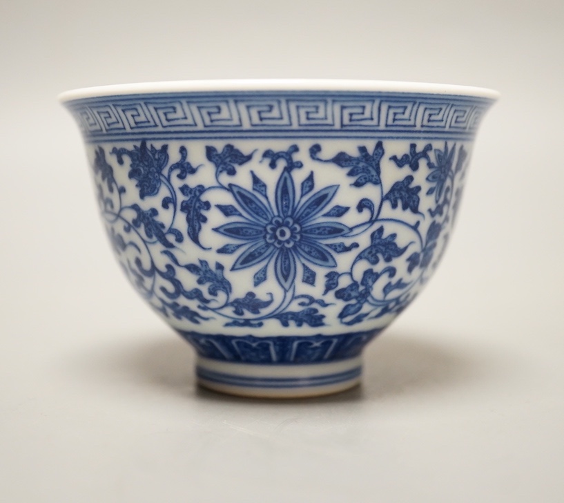 A Chinese blue and white 'lotus' cup. 9cm diameter
